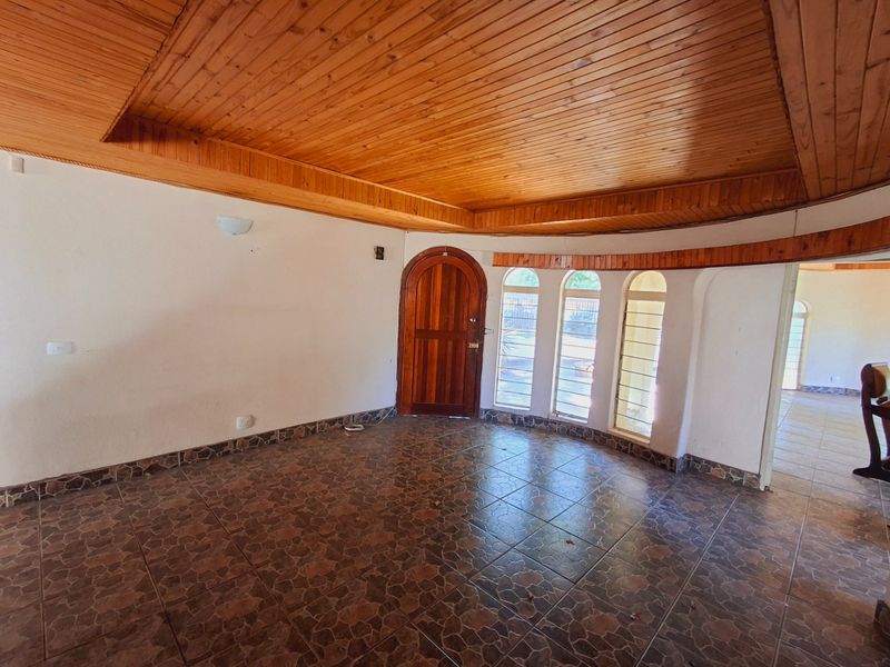 "4-bedroom home within walking distance to a popular high school, with lots of potential." - Photo 2