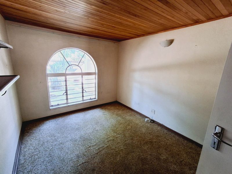 "4-bedroom home within walking distance to a popular high school, with lots of potential." - Photo 10