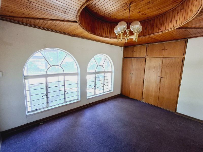 "4-bedroom home within walking distance to a popular high school, with lots of potential." - Photo 9