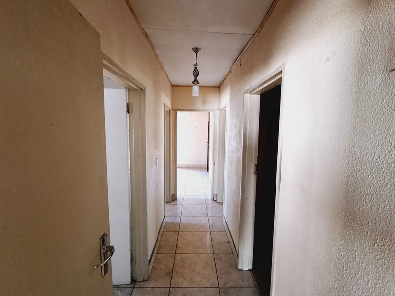 "4-bedroom home within walking distance to a popular high school, with lots of potential." - Photo 7