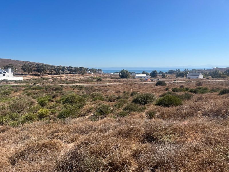 A scenic view of the coastal landscape and surrounding area from the vacant residential land plot.