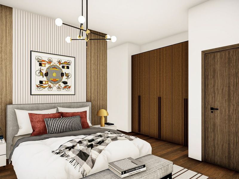 A modern bedroom featuring high-quality timber flooring, floor-to-ceiling built-in wardrobes, and a stylish feature wall with integrated lighting.