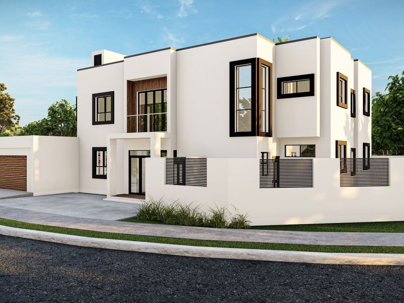 A modern two-story residential house featuring a clean white facade, black window frames, a balcony, and an integrated garage.