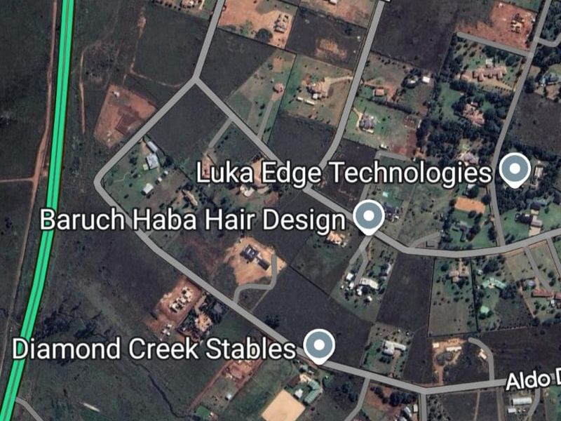 An aerial satellite view of the residential area showing local street layouts and surrounding land plots.