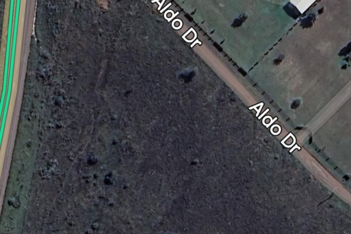 Aerial view of a vacant residential plot located at the corner of Ursala Street and Aldo Drive.