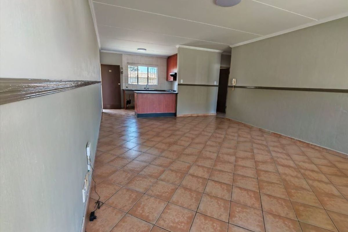 Cozy Two-Bedroom Home with Secure Parking - Photo 2