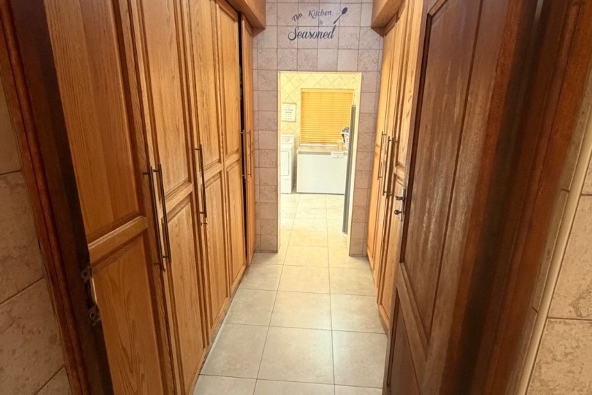 Modern Double-Storey Family Home on a Plot – Luxury Living at Its Best!  Step into elegance with this stunning modern double-storey home situated on a spacious plot, offering comfort, style, and exceptional entertainment features — perfect for a large family who loves both space and sophistication. Property Features: 	•	3 Spacious Bedrooms 	•	Dedicated Study / Home Office 	•	Stylish Makeup Room / Dressing Room 	•	3 Modern Bathrooms  	•	Beautiful, Modern Kitchen with Quality Finishes Separate Laundry Room 	•	2 Comfortable Lounges 	•	Elegant Dining Room  ?? Parking & Extras: 	•	3 Garages with Ample Parking Space 	•	Situated on a Plot – Peaceful and Private Living  ?? Entertainment & Outdoor Living: 	•	Sparkling Swimming Pool 	•	Lapa with Entertainment Area – Perfect for Hosting Family & Friends 	•	Spacious Yard with Plenty of Room for Kids to Enjoy  This home is very neat, modern, and move-in ready, offering the perfect balance between luxury and family living. - Photo 5