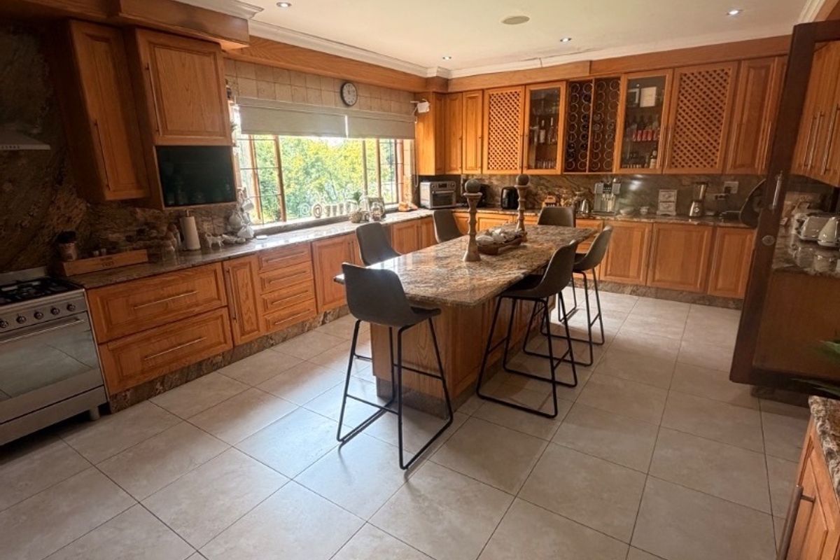 Modern Double-Storey Family Home on a Plot – Luxury Living at Its Best!  Step into elegance with this stunning modern double-storey home situated on a spacious plot, offering comfort, style, and exceptional entertainment features — perfect for a large family who loves both space and sophistication. Property Features: 	•	3 Spacious Bedrooms 	•	Dedicated Study / Home Office 	•	Stylish Makeup Room / Dressing Room 	•	3 Modern Bathrooms  	•	Beautiful, Modern Kitchen with Quality Finishes Separate Laundry Room 	•	2 Comfortable Lounges 	•	Elegant Dining Room  ?? Parking & Extras: 	•	3 Garages with Ample Parking Space 	•	Situated on a Plot – Peaceful and Private Living  ?? Entertainment & Outdoor Living: 	•	Sparkling Swimming Pool 	•	Lapa with Entertainment Area – Perfect for Hosting Family & Friends 	•	Spacious Yard with Plenty of Room for Kids to Enjoy  This home is very neat, modern, and move-in ready, offering the perfect balance between luxury and family living. - Photo 4