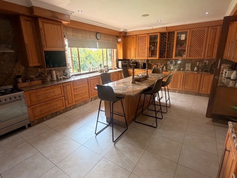 Modern Double-Storey Family Home on a Plot – Luxury Living at Its Best!  Step into elegance with this stunning modern double-storey home situated on a spacious plot, offering comfort, style, and exceptional entertainment features — perfect for a large family who loves both space and sophistication. Property Features: 	•	3 Spacious Bedrooms 	•	Dedicated Study / Home Office 	•	Stylish Makeup Room / Dressing Room 	•	3 Modern Bathrooms  	•	Beautiful, Modern Kitchen with Quality Finishes Separate Laundry Room 	•	2 Comfortable Lounges 	•	Elegant Dining Room  ?? Parking & Extras: 	•	3 Garages with Ample Parking Space 	•	Situated on a Plot – Peaceful and Private Living  ?? Entertainment & Outdoor Living: 	•	Sparkling Swimming Pool 	•	Lapa with Entertainment Area – Perfect for Hosting Family & Friends 	•	Spacious Yard with Plenty of Room for Kids to Enjoy  This home is very neat, modern, and move-in ready, offering the perfect balance between luxury and family living. - Photo 4