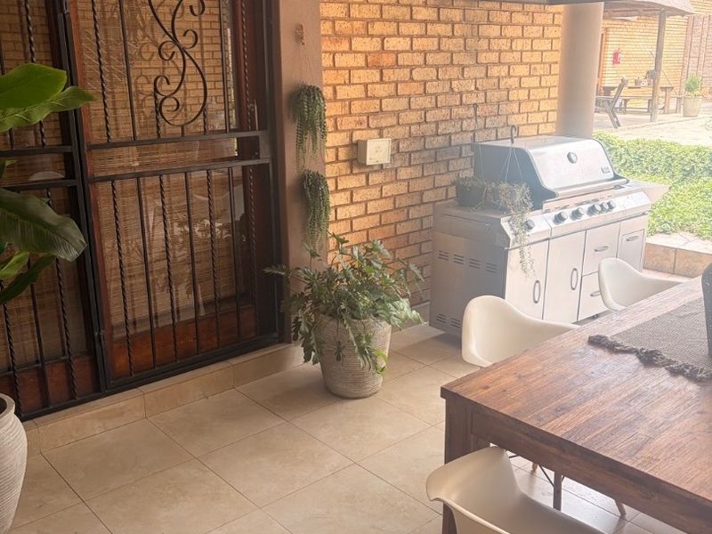 Modern Double-Storey Family Home on a Plot – Luxury Living at Its Best!  Step into elegance with this stunning modern double-storey home situated on a spacious plot, offering comfort, style, and exceptional entertainment features — perfect for a large family who loves both space and sophistication. Property Features: 	•	3 Spacious Bedrooms 	•	Dedicated Study / Home Office 	•	Stylish Makeup Room / Dressing Room 	•	3 Modern Bathrooms  	•	Beautiful, Modern Kitchen with Quality Finishes Separate Laundry Room 	•	2 Comfortable Lounges 	•	Elegant Dining Room  ?? Parking & Extras: 	•	3 Garages with Ample Parking Space 	•	Situated on a Plot – Peaceful and Private Living  ?? Entertainment & Outdoor Living: 	•	Sparkling Swimming Pool 	•	Lapa with Entertainment Area – Perfect for Hosting Family & Friends 	•	Spacious Yard with Plenty of Room for Kids to Enjoy  This home is very neat, modern, and move-in ready, offering the perfect balance between luxury and family living. - Photo 10