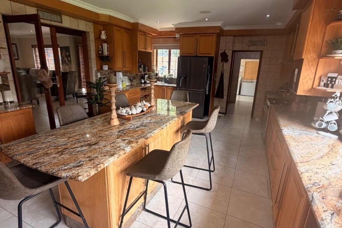 Modern Double-Storey Family Home on a Plot – Luxury Living at Its Best!  Step into elegance with this stunning modern double-storey home situated on a spacious plot, offering comfort, style, and exceptional entertainment features — perfect for a large family who loves both space and sophistication. Property Features: 	•	3 Spacious Bedrooms 	•	Dedicated Study / Home Office 	•	Stylish Makeup Room / Dressing Room 	•	3 Modern Bathrooms  	•	Beautiful, Modern Kitchen with Quality Finishes Separate Laundry Room 	•	2 Comfortable Lounges 	•	Elegant Dining Room  ?? Parking & Extras: 	•	3 Garages with Ample Parking Space 	•	Situated on a Plot – Peaceful and Private Living  ?? Entertainment & Outdoor Living: 	•	Sparkling Swimming Pool 	•	Lapa with Entertainment Area – Perfect for Hosting Family & Friends 	•	Spacious Yard with Plenty of Room for Kids to Enjoy  This home is very neat, modern, and move-in ready, offering the perfect balance between luxury and family living. - Photo 2