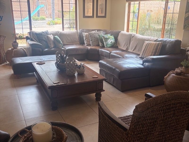 Modern Double-Storey Family Home on a Plot – Luxury Living at Its Best!  Step into elegance with this stunning modern double-storey home situated on a spacious plot, offering comfort, style, and exceptional entertainment features — perfect for a large family who loves both space and sophistication. Property Features: 	•	3 Spacious Bedrooms 	•	Dedicated Study / Home Office 	•	Stylish Makeup Room / Dressing Room 	•	3 Modern Bathrooms  	•	Beautiful, Modern Kitchen with Quality Finishes Separate Laundry Room 	•	2 Comfortable Lounges 	•	Elegant Dining Room  ?? Parking & Extras: 	•	3 Garages with Ample Parking Space 	•	Situated on a Plot – Peaceful and Private Living  ?? Entertainment & Outdoor Living: 	•	Sparkling Swimming Pool 	•	Lapa with Entertainment Area – Perfect for Hosting Family & Friends 	•	Spacious Yard with Plenty of Room for Kids to Enjoy  This home is very neat, modern, and move-in ready, offering the perfect balance between luxury and family living. - Photo 8