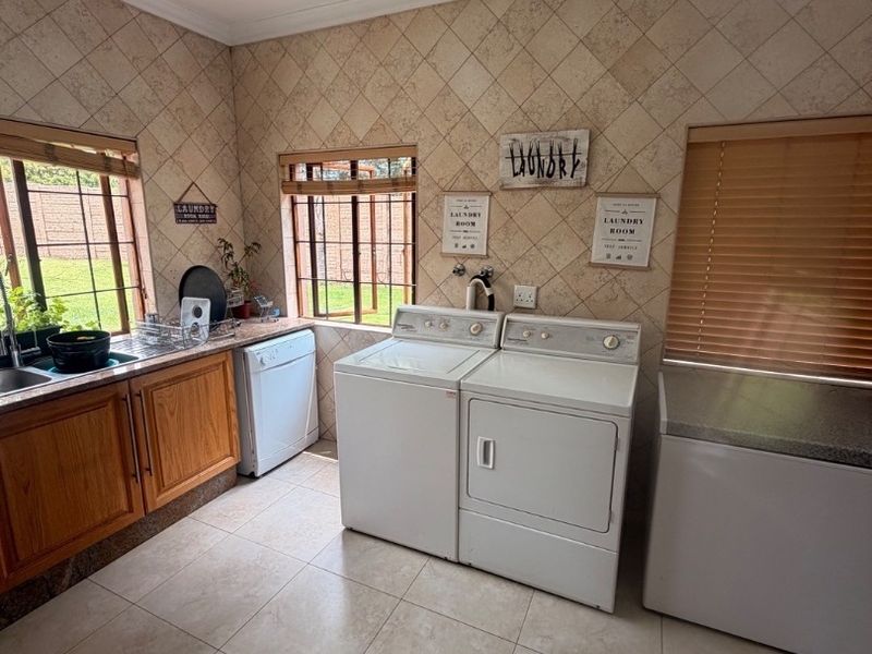 Modern Double-Storey Family Home on a Plot – Luxury Living at Its Best!  Step into elegance with this stunning modern double-storey home situated on a spacious plot, offering comfort, style, and exceptional entertainment features — perfect for a large family who loves both space and sophistication. Property Features: 	•	3 Spacious Bedrooms 	•	Dedicated Study / Home Office 	•	Stylish Makeup Room / Dressing Room 	•	3 Modern Bathrooms  	•	Beautiful, Modern Kitchen with Quality Finishes Separate Laundry Room 	•	2 Comfortable Lounges 	•	Elegant Dining Room  ?? Parking & Extras: 	•	3 Garages with Ample Parking Space 	•	Situated on a Plot – Peaceful and Private Living  ?? Entertainment & Outdoor Living: 	•	Sparkling Swimming Pool 	•	Lapa with Entertainment Area – Perfect for Hosting Family & Friends 	•	Spacious Yard with Plenty of Room for Kids to Enjoy  This home is very neat, modern, and move-in ready, offering the perfect balance between luxury and family living. - Photo 7