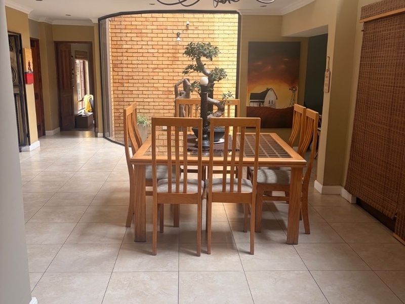 Modern Double-Storey Family Home on a Plot – Luxury Living at Its Best!  Step into elegance with this stunning modern double-storey home situated on a spacious plot, offering comfort, style, and exceptional entertainment features — perfect for a large family who loves both space and sophistication. Property Features: 	•	3 Spacious Bedrooms 	•	Dedicated Study / Home Office 	•	Stylish Makeup Room / Dressing Room 	•	3 Modern Bathrooms  	•	Beautiful, Modern Kitchen with Quality Finishes Separate Laundry Room 	•	2 Comfortable Lounges 	•	Elegant Dining Room  ?? Parking & Extras: 	•	3 Garages with Ample Parking Space 	•	Situated on a Plot – Peaceful and Private Living  ?? Entertainment & Outdoor Living: 	•	Sparkling Swimming Pool 	•	Lapa with Entertainment Area – Perfect for Hosting Family & Friends 	•	Spacious Yard with Plenty of Room for Kids to Enjoy  This home is very neat, modern, and move-in ready, offering the perfect balance between luxury and family living. - Photo 6