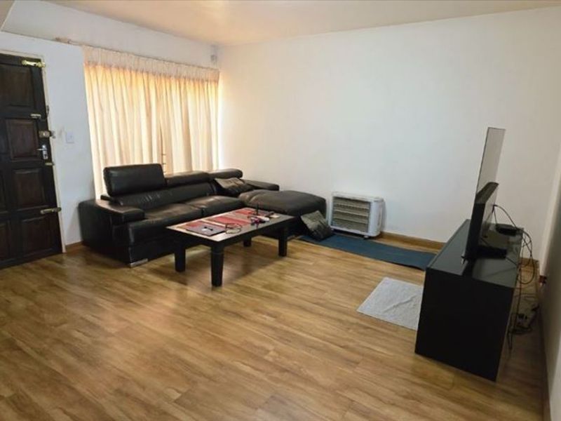 Spacious Three-Bedroom Home with Garage and Carport - Photo 2