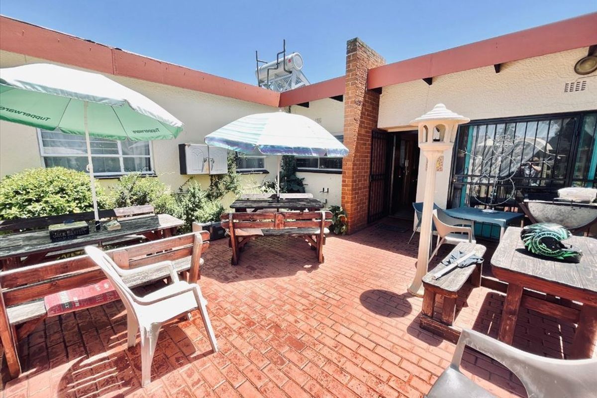 Luxurious Five-Bedroom Home with Multiple Living Areas - Photo 3