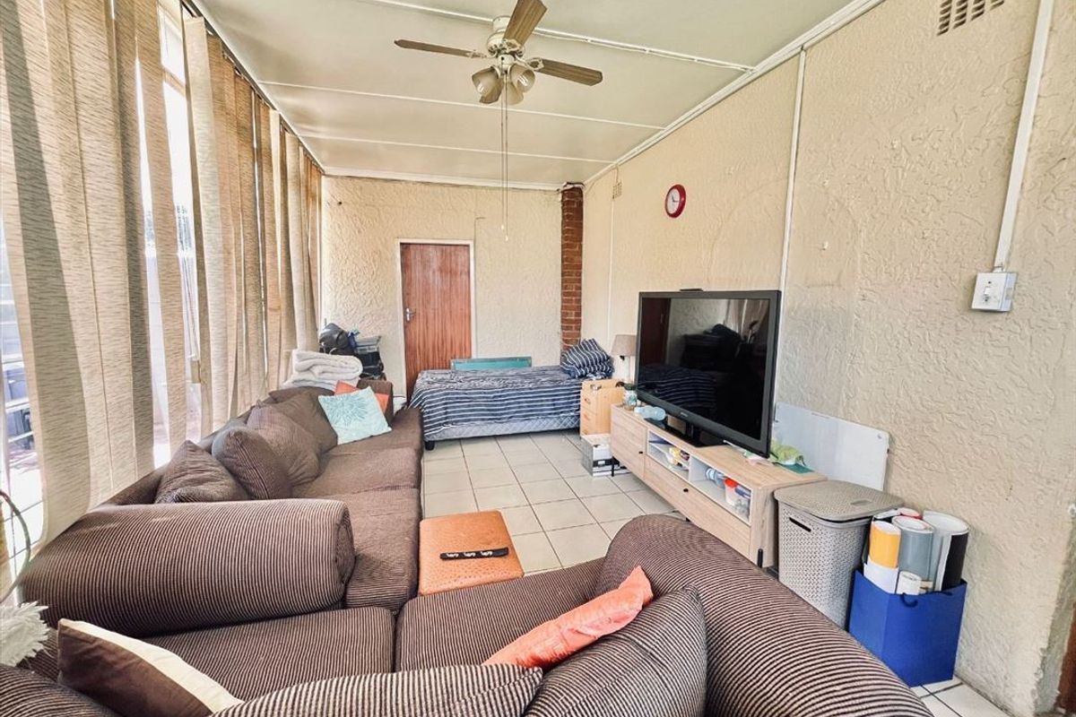 Luxurious Five-Bedroom Home with Multiple Living Areas - Photo 2