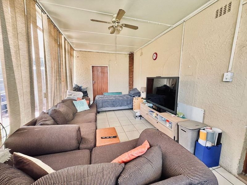 Luxurious Five-Bedroom Home with Multiple Living Areas - Photo 2