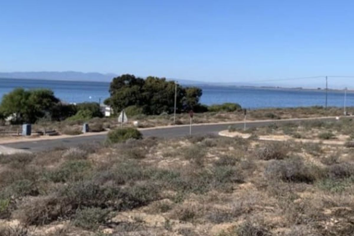 A scenic view of the coastal landscape and nearby water, showcasing the natural surroundings of the vacant residential land.