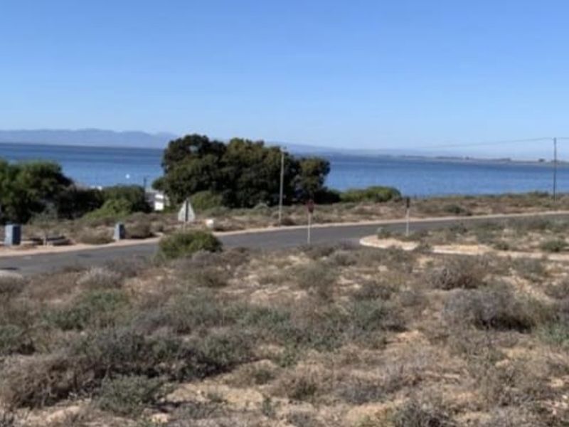 A scenic view of the coastal landscape and nearby water, showcasing the natural surroundings of the vacant residential land.