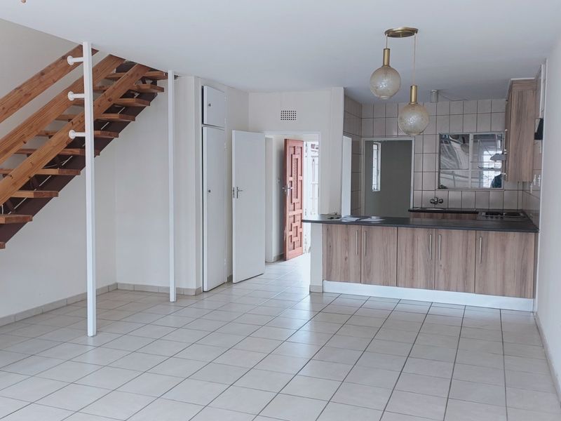 Nestled in the heart of charming Krugersdorp North, this delightful townhouse - Photo 5