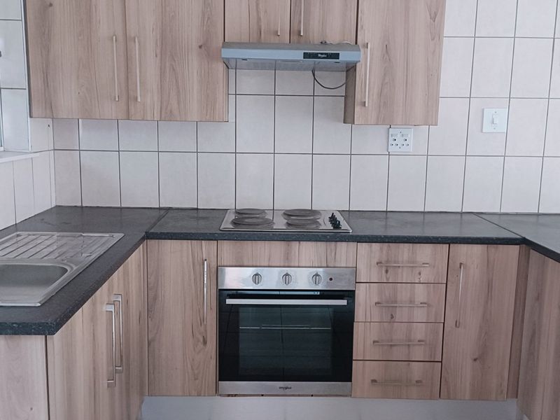 Nestled in the heart of charming Krugersdorp North, this delightful townhouse - Photo 3