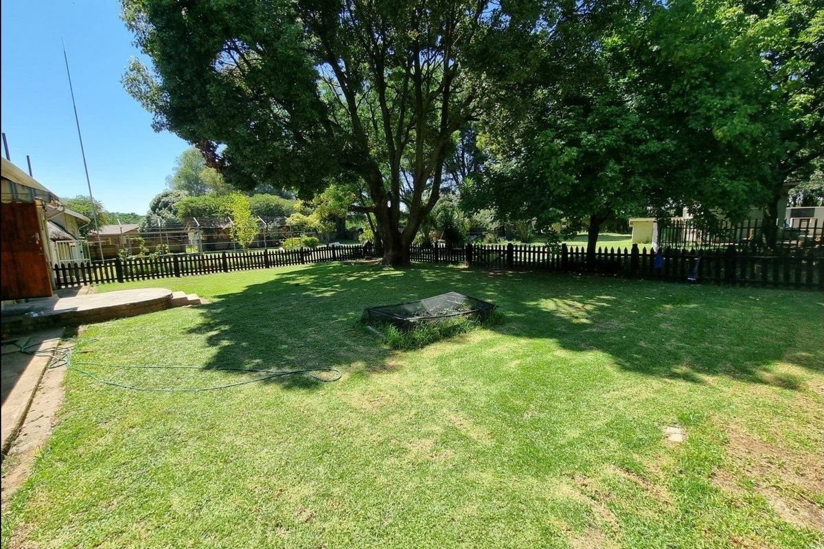 Beautiful Plot for Sale – Exceptional Investment Opportunity!  This beautiful and spacious plot offers the perfect combination of comfortable family living and outstanding rental income potential ideal for investors or extended families looking for space and security. Main House Features: 3 Spacious Bedrooms Large Loft Area (perfect for office, extra bedroom, or entertainment space) Generous Living Areas Beautiful, well-maintained home with plenty of character  Additional Features: 4 Garages Large Workshop Area Swimming Pool Very safe and secure property Expansive grounds with endless possibilities Income-Generating Potential: Townhouses on the property currently used for rental income Furnished bedroom units available to rent out Excellent opportunity for investors seeking multiple income streams This unique property offers space, versatility, and strong rental returns — all in one stunning setting. Perfect for investors, business owners, or families wanting additional income from home.  Don’t miss out on this rare opportunity — contact us today to arrange a viewing! - Photo 3