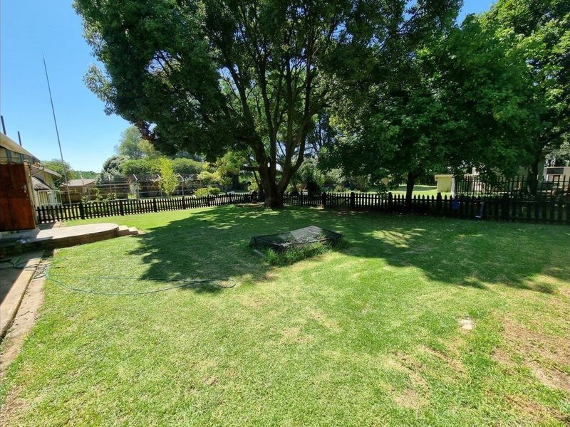 Beautiful Plot for Sale – Exceptional Investment Opportunity!  This beautiful and spacious plot offers the perfect combination of comfortable family living and outstanding rental income potential ideal for investors or extended families looking for space and security. Main House Features: 3 Spacious Bedrooms Large Loft Area (perfect for office, extra bedroom, or entertainment space) Generous Living Areas Beautiful, well-maintained home with plenty of character  Additional Features: 4 Garages Large Workshop Area Swimming Pool Very safe and secure property Expansive grounds with endless possibilities Income-Generating Potential: Townhouses on the property currently used for rental income Furnished bedroom units available to rent out Excellent opportunity for investors seeking multiple income streams This unique property offers space, versatility, and strong rental returns — all in one stunning setting. Perfect for investors, business owners, or families wanting additional income from home.  Don’t miss out on this rare opportunity — contact us today to arrange a viewing! - Photo 3