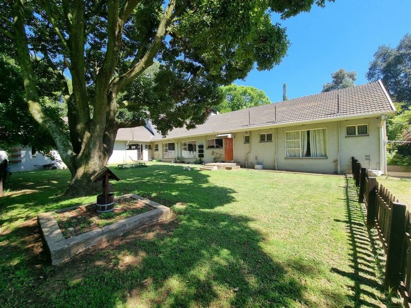 Beautiful Plot for Sale – Exceptional Investment Opportunity!  This beautiful and spacious plot offers the perfect combination of comfortable family living and outstanding rental income potential ideal for investors or extended families looking for space and security. Main House Features: 3 Spacious Bedrooms Large Loft Area (perfect for office, extra bedroom, or entertainment space) Generous Living Areas Beautiful, well-maintained home with plenty of character  Additional Features: 4 Garages Large Workshop Area Swimming Pool Very safe and secure property Expansive grounds with endless possibilities Income-Generating Potential: Townhouses on the property currently used for rental income Furnished bedroom units available to rent out Excellent opportunity for investors seeking multiple income streams This unique property offers space, versatility, and strong rental returns — all in one stunning setting. Perfect for investors, business owners, or families wanting additional income from home.  Don’t miss out on this rare opportunity — contact us today to arrange a viewing! - Photo 9