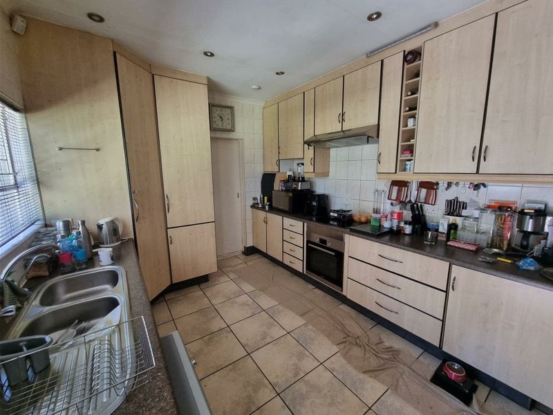 Beautiful Plot for Sale – Exceptional Investment Opportunity!  This beautiful and spacious plot offers the perfect combination of comfortable family living and outstanding rental income potential ideal for investors or extended families looking for space and security. Main House Features: 3 Spacious Bedrooms Large Loft Area (perfect for office, extra bedroom, or entertainment space) Generous Living Areas Beautiful, well-maintained home with plenty of character  Additional Features: 4 Garages Large Workshop Area Swimming Pool Very safe and secure property Expansive grounds with endless possibilities Income-Generating Potential: Townhouses on the property currently used for rental income Furnished bedroom units available to rent out Excellent opportunity for investors seeking multiple income streams This unique property offers space, versatility, and strong rental returns — all in one stunning setting. Perfect for investors, business owners, or families wanting additional income from home.  Don’t miss out on this rare opportunity — contact us today to arrange a viewing! - Photo 8