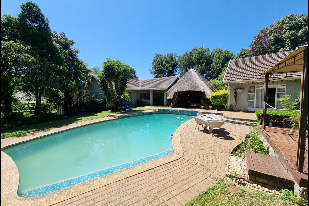 Beautiful Plot for Sale – Exceptional Investment Opportunity!  This beautiful and spacious plot offers the perfect combination of comfortable family living and outstanding rental income potential ideal for investors or extended families looking for space and security. Main House Features: 3 Spacious Bedrooms Large Loft Area (perfect for office, extra bedroom, or entertainment space) Generous Living Areas Beautiful, well-maintained home with plenty of character  Additional Features: 4 Garages Large Workshop Area Swimming Pool Very safe and secure property Expansive grounds with endless possibilities Income-Generating Potential: Townhouses on the property currently used for rental income Furnished bedroom units available to rent out Excellent opportunity for investors seeking multiple income streams This unique property offers space, versatility, and strong rental returns — all in one stunning setting. Perfect for investors, business owners, or families wanting additional income from home.  Don’t miss out on this rare opportunity — contact us today to arrange a viewing! - Photo 2