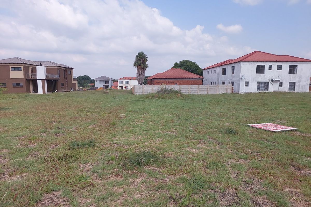 A vacant residential plot of land situated in a developed neighborhood, offering a clear space for future construction.