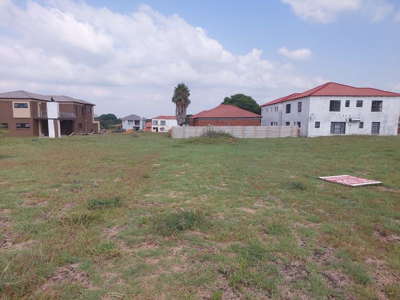 A vacant residential plot of land situated in a developed neighborhood, offering a clear space for future construction.