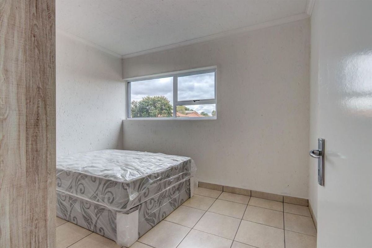 Neat Two-Bedroom Home with Welcoming Living Spaces - Photo 3