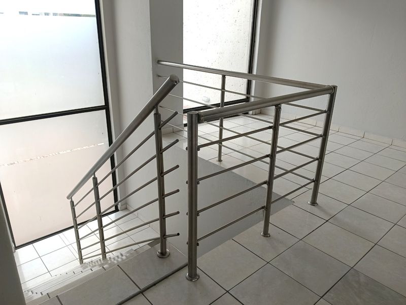 Elegant Double-Storey Living with Balconies & Built-In Braai - Photo 9