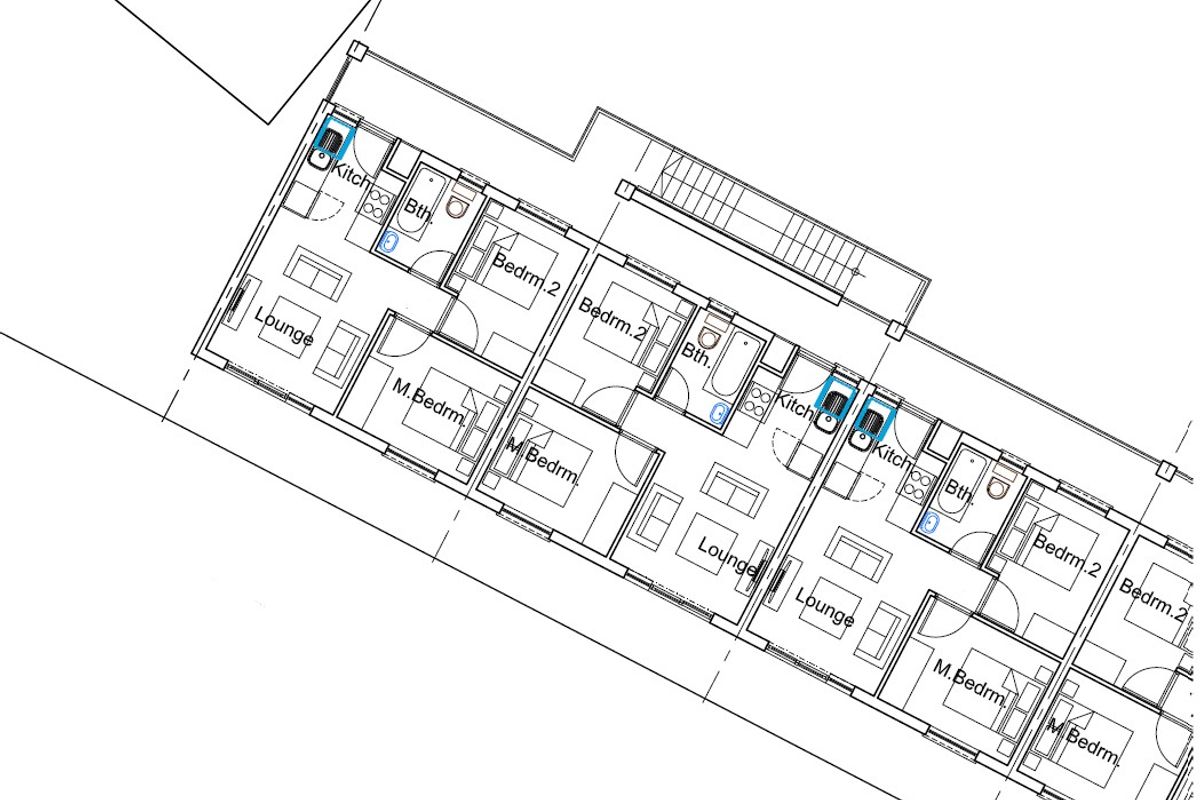A detailed architectural floor plan showing the layout of multiple residential units, including kitchens, bathrooms, lounges, and bedrooms.