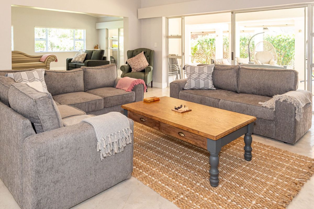 Spacious living room featuring large sliding glass doors that provide natural light and seamless access to the outdoor patio area.