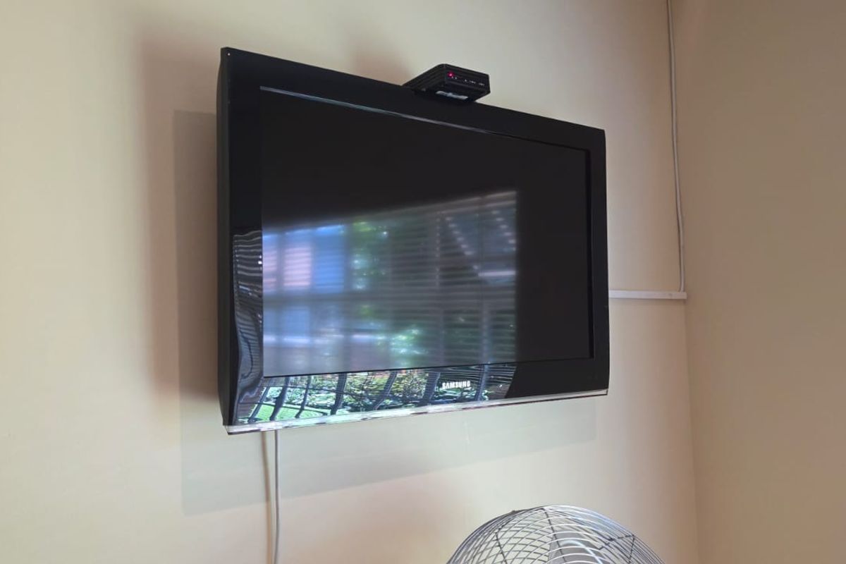A wall-mounted television unit installed in a living space.