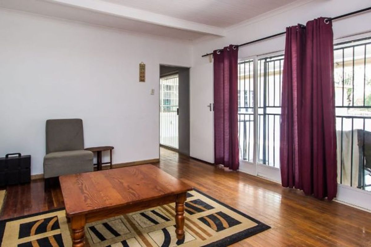 Versatile 4-Bedroom Home with 3 Income-Generating Flatlets & Entertainment Area - Photo 4