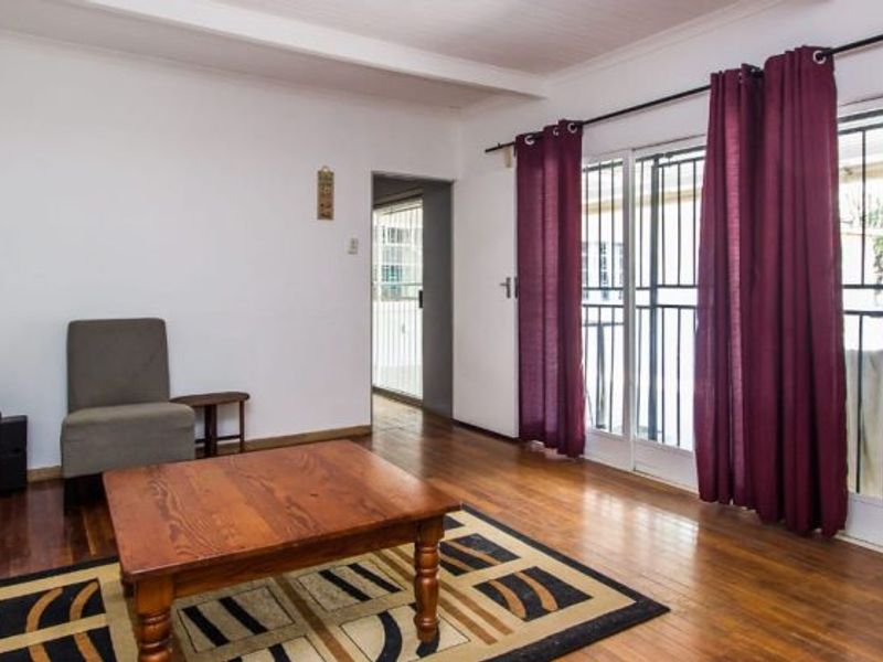 Versatile 4-Bedroom Home with 3 Income-Generating Flatlets & Entertainment Area - Photo 4