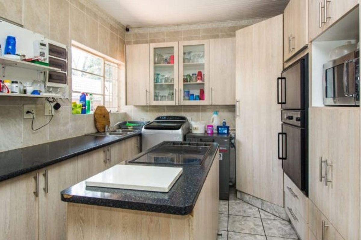 Versatile 4-Bedroom Home with 3 Income-Generating Flatlets & Entertainment Area - Photo 3