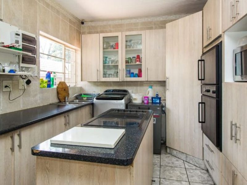 Versatile 4-Bedroom Home with 3 Income-Generating Flatlets & Entertainment Area - Photo 3