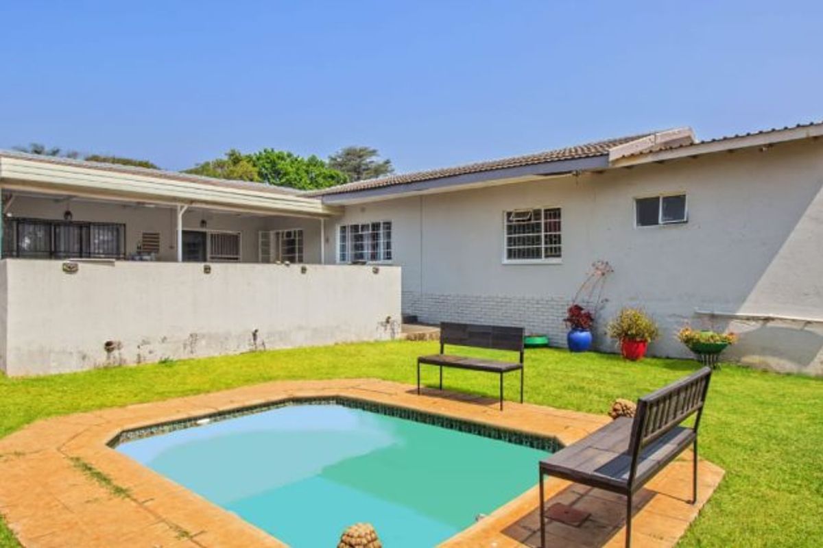 Versatile 4-Bedroom Home with 3 Income-Generating Flatlets & Entertainment Area - Photo 2