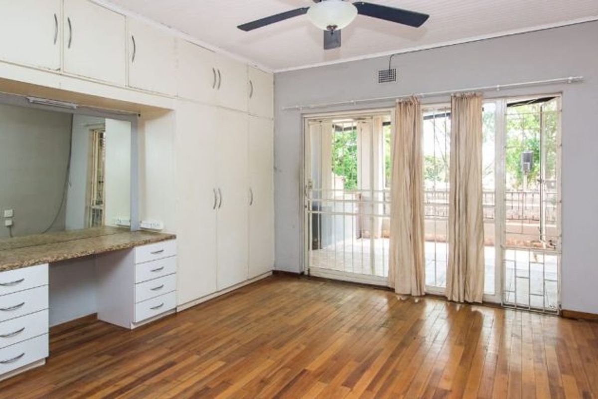 Versatile 4-Bedroom Home with 3 Income-Generating Flatlets & Entertainment Area - Photo 5