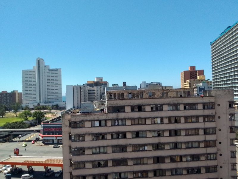 An elevated urban view overlooking surrounding high-rise apartment buildings and city infrastructure.