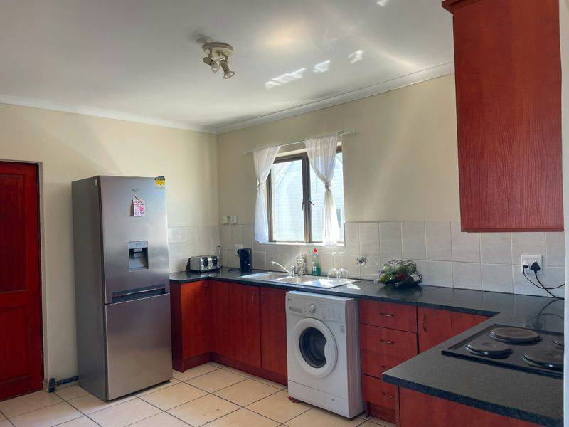 Spacious Top-Floor Retreat with Private Garage, Braai Balcony & Secure Living in Manhattan Park Complex - Photo 5