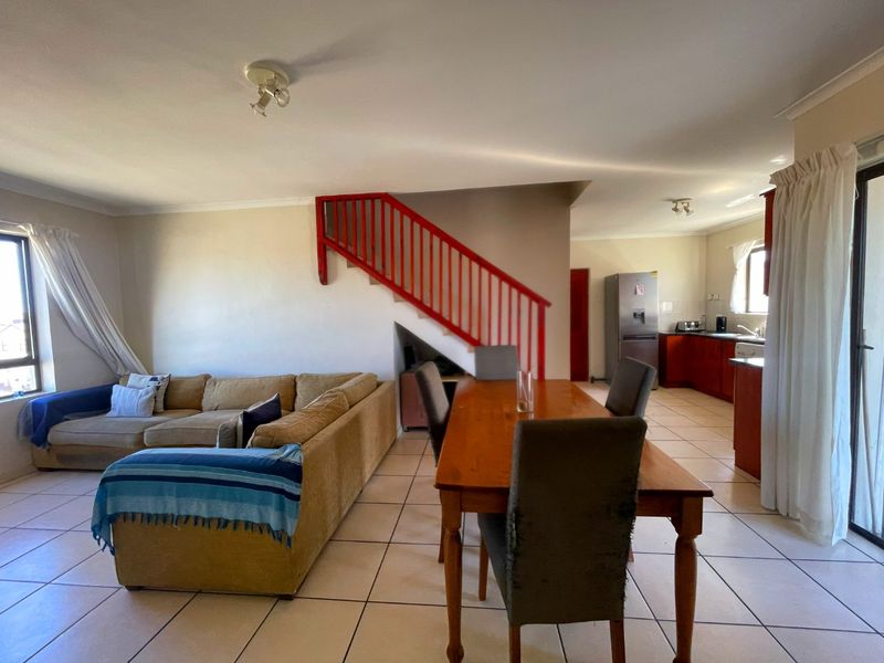Spacious Top-Floor Retreat with Private Garage, Braai Balcony & Secure Living in Manhattan Park Complex - Photo 6