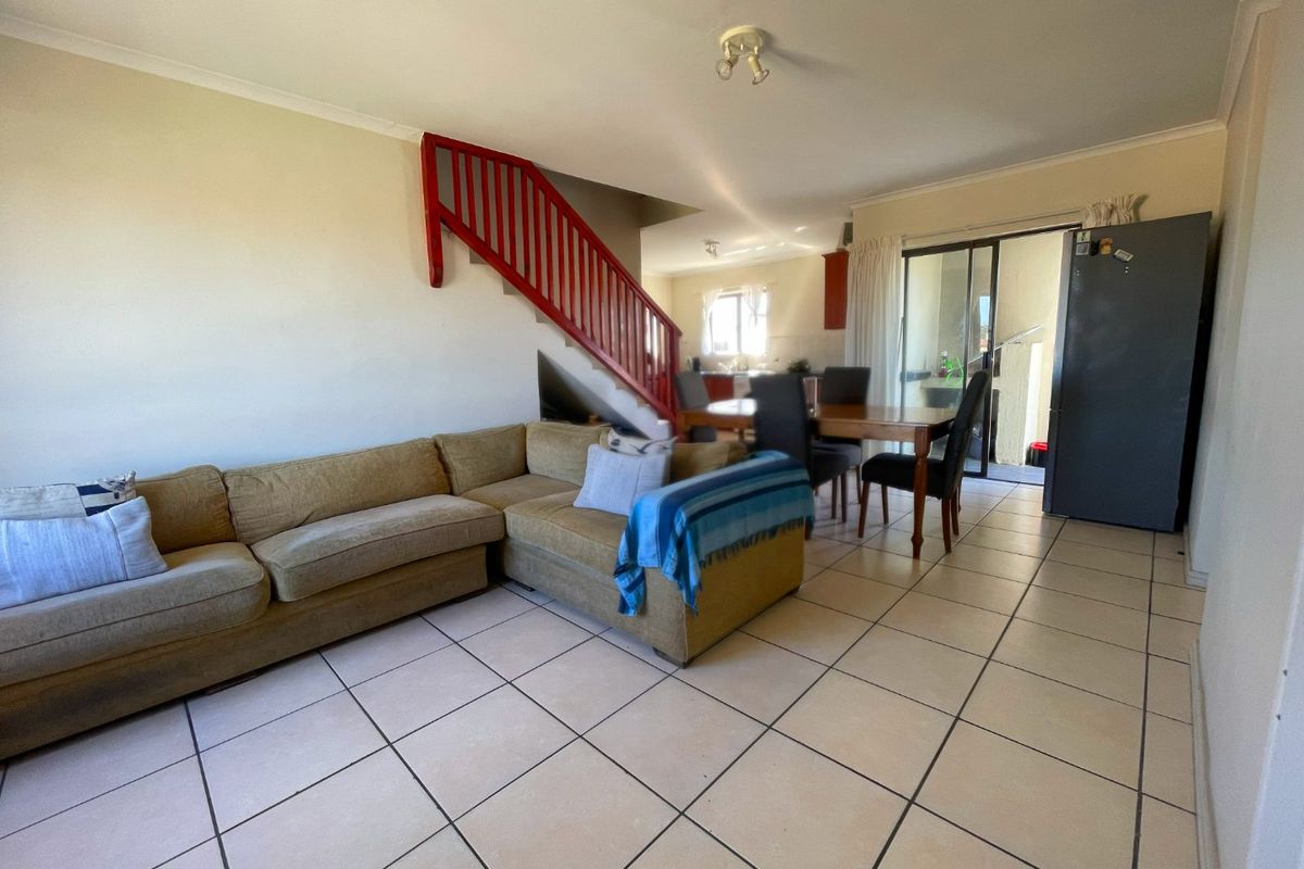 Spacious Top-Floor Retreat with Private Garage, Braai Balcony & Secure Living in Manhattan Park Complex - Photo 2