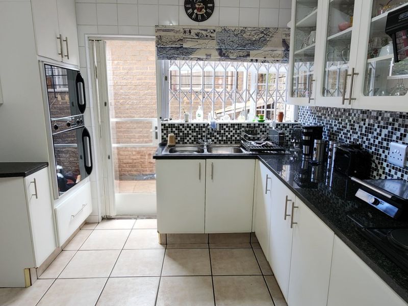 Elegant, Secure Family Living with Modern Comforts and Exceptional Convenience - Photo 3