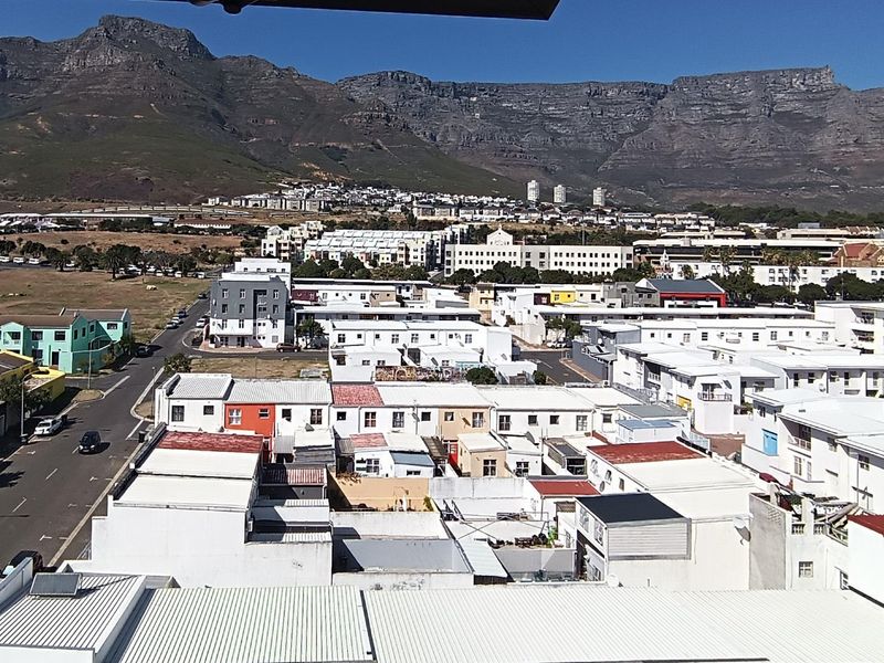 Elevated panoramic view overlooking the surrounding residential neighborhood with a prominent mountain range in the background.